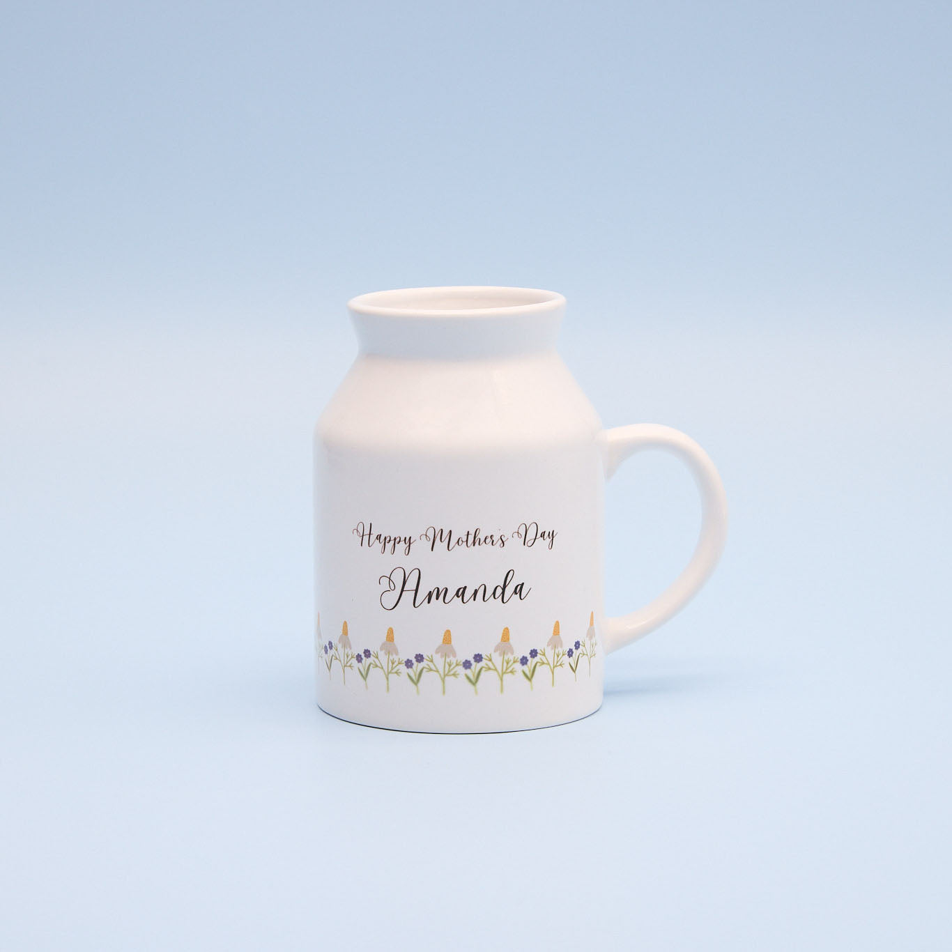White sublimation milk jug with 'Happy Mother's Day Amanda' text on a light blue background