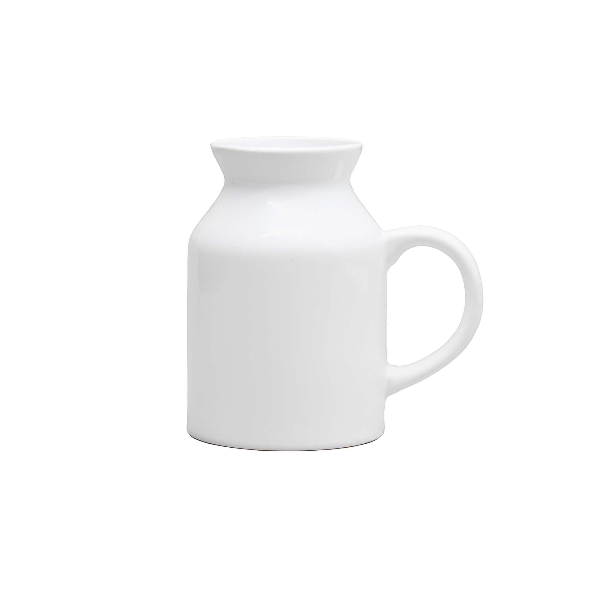 White ceramic milk jug on a white background
